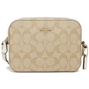 authentic mini COACH camera bag in color tan with logo. In great condition